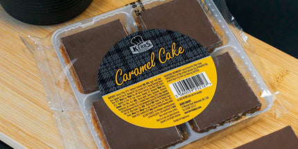 Caramel cake slices with packaging on a wooden board
