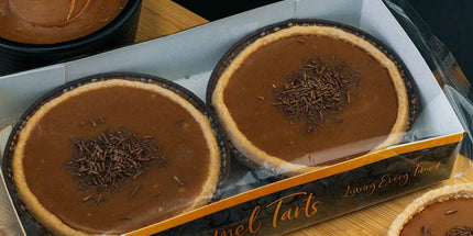 Chocolate tarts in a box with a dark background